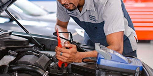 technician inspecting the car 