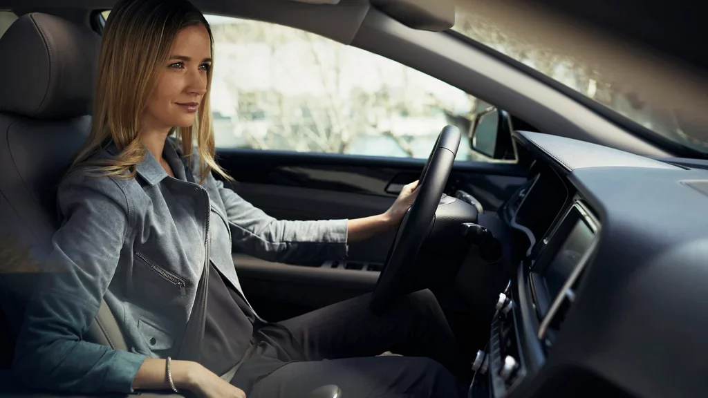 women sitting on driving seat